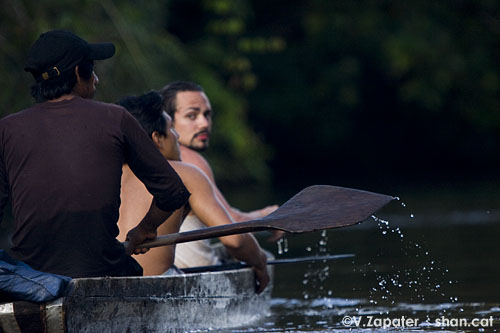 David and Waorani people paddling on Yasuni river
